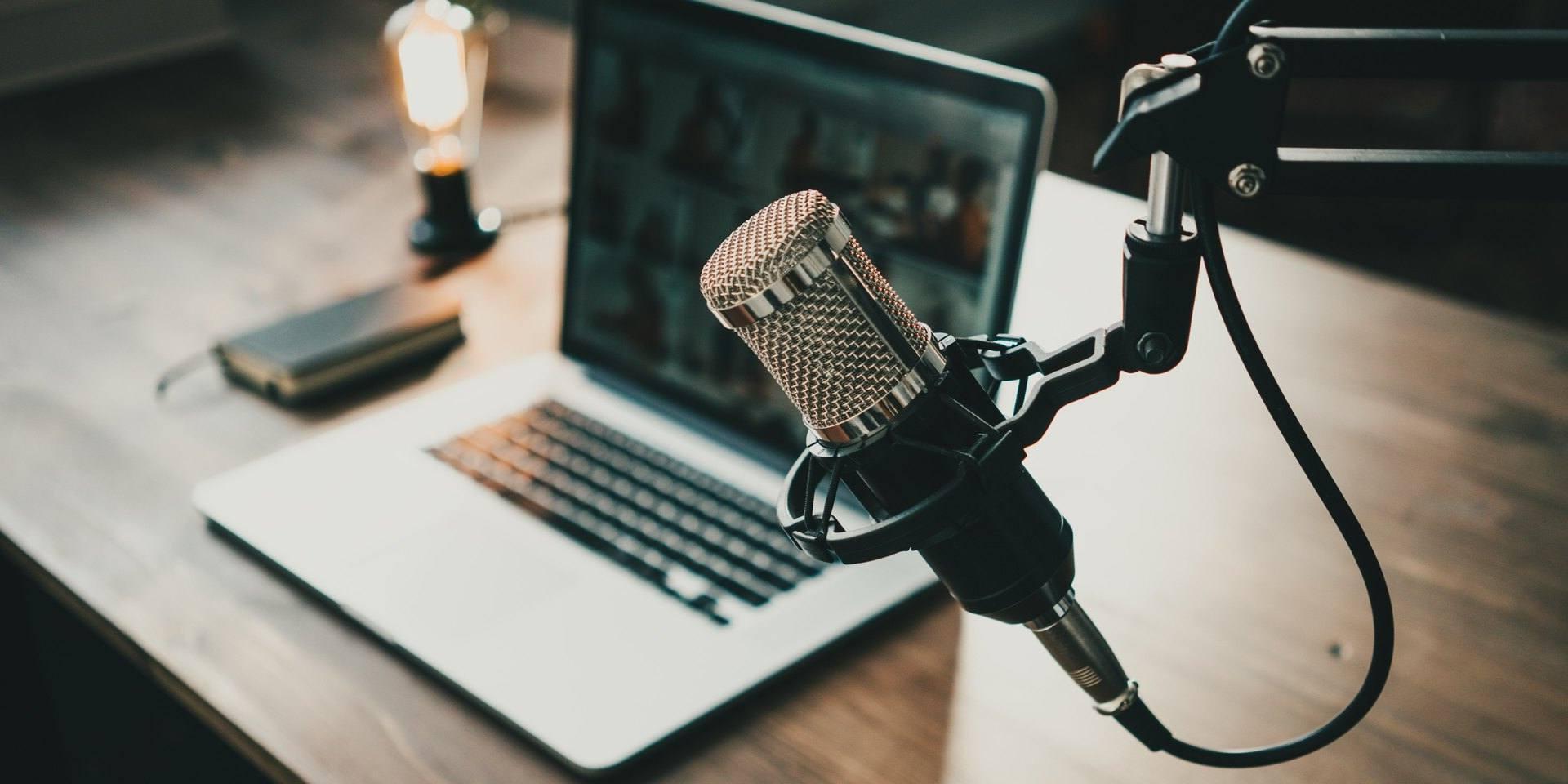 Podcast set-up with microphone and computer 